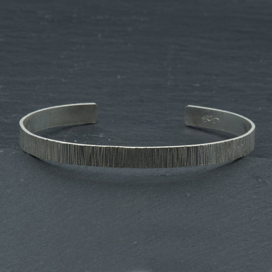 Textured Silver cuff bracelet on Slate background